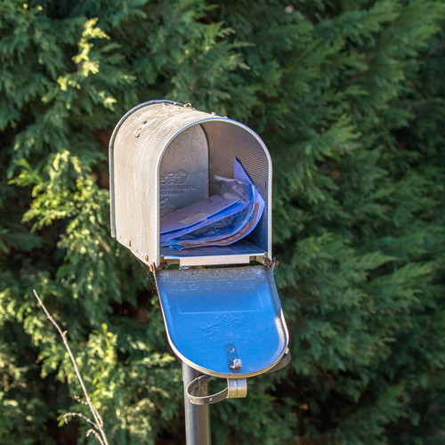 A mailbox with mail in it